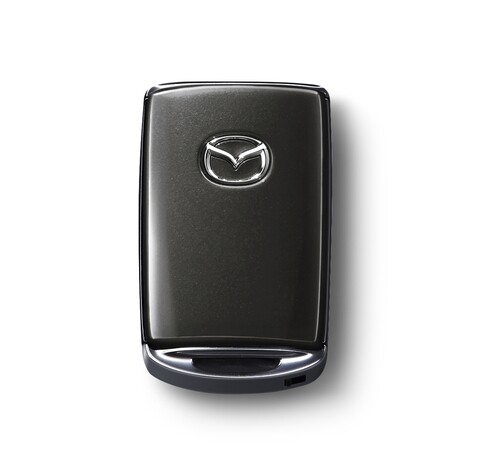 Transponder-Schlüsselgehäuse von Mazda in Matrixgrau Metallic.
